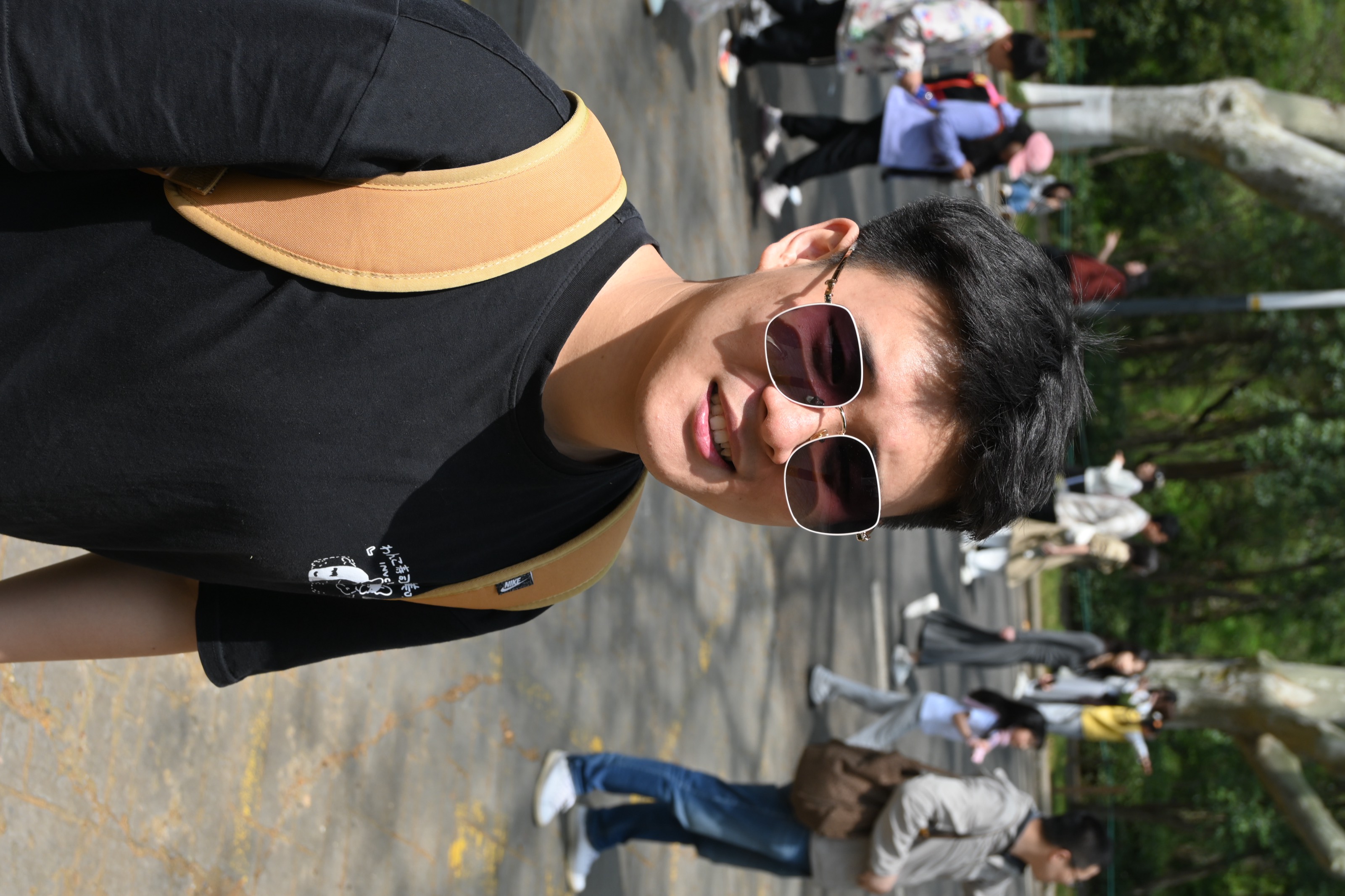 Naichuan Sun wearing sunglasses outdoors